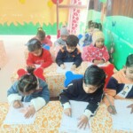 "At Champs Foundation Preschool & Day Boarding, our little champs are exploring new ideas and having fun while learning in the classroom! 📚✨ Every lesson is a step towards growing their knowledge, creativity, and curiosity, as they enjoy learning in a playful and supportive environment." "Children actively participating in classroom learning at Champs Foundation Preschool & Day Boarding, engaging with books and educational activities."